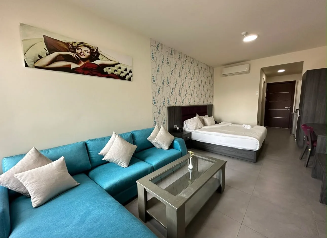 Suite with a sofa and a bed